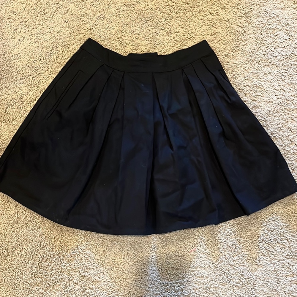 Pleated black mini skirt